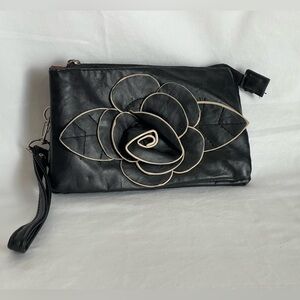 Fun little black faux, leather clutch wristlet three pocket with a zipper